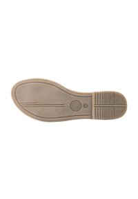 Suola di scarpa beige chiaro con una superficie liscia, forma arrotondata e tacco texturizzato con linee parallele e accento circolare vicino al centro.