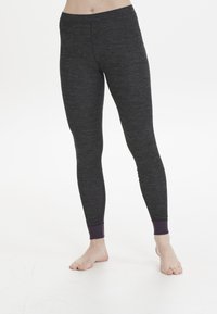 Grå leggings gjorda av texturerad tyg, med lila mudd vid anklarna, en figurnära design och ett elastiskt midjeband.