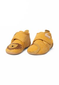 Scarpine per bambini in tessuto giallo con un design a faccia di leone sulla punta. Presentano una chiusura in velcro e una superficie testurizzata per una migliore presa. Soletti morbidi.