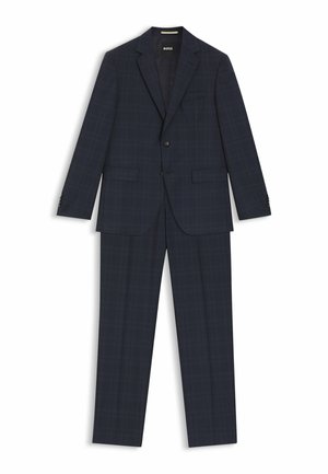 Laivastonsininen ruudullinen puku, jossa on lovettu kaulus, kaksi etutaskua, yksinappinen suljenta ja siihen sopivat housut, joissa on silityssilitysdetaili.