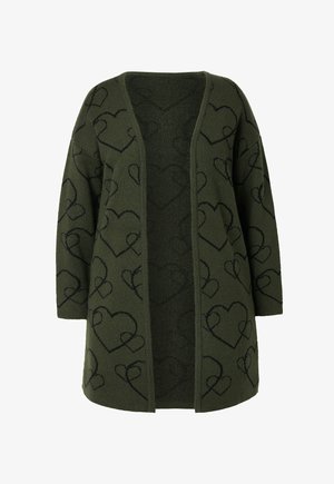 Olivengrøn strikket cardigan med V-udskæring, åben front og sorte hjerte-mønstre overalt. Blød tekstur, lange ærmer og løs pasform.