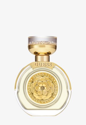 Gjennomsiktig, rund parfymeflaske med gullfarget hette og bunn. Gravert blomsterdesign i midten, klar væske synlig inni.