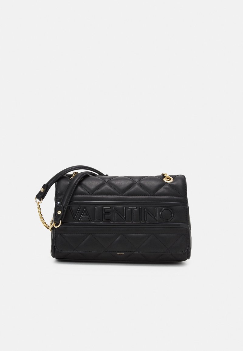 Black quilted leather handbag with gold chain accents, embossed “VALENTINO” logo, rectangular shape, and a detachable shoulder strap.