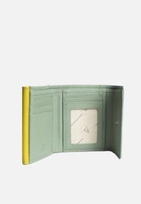 Green leather wallet with a yellow accent, featuring multiple card slots and a clear ID window on an interior fabric with geometric patterns.