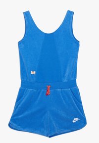 Blue cotton blend romper with a scoop neckline, elastic waistband, front pockets, and red drawstring. Features Nike logo on lower front.
