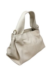 Miękka beżowa skórzana torba na ramię z szerokim paskiem i złotymi pierścieniami, o luźnym kształcie i widocznym przeszyciu na gładkiej powierzchni.