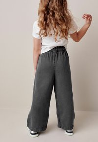 Next WIDE LEG - Flared jeans - charcoal grey