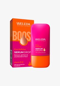 Weleda Pore Refining Serum Drops emballage har en klar pink flaske med en orange bund. Æsken er orange med hvid tekst og et dråbeikon.