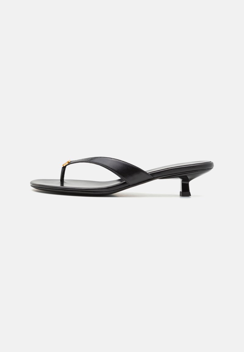 Black leather thong sandals featuring a small square heel, sleek design, and a subtle gold accent at the upper strap.