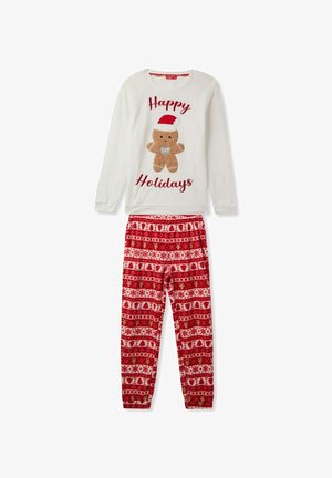 Maglietta da pigiama bianca a maniche lunghe con un design di gingerbread e testo "Buone Feste", abbinata a pantaloni da pigiama rossi con motivo decorativo natalizio.