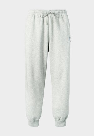 Gaiši pelēcīgas bikses no mīksta materiāla ar elastīgu jostu, auklu un ribotām aprocēm; sānos ir maza logo.