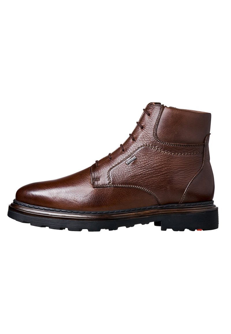 Brown leather ankle boots with textured finish, lacing, and a sturdy black rubber sole with tread for traction. Reinforced stitching details.
