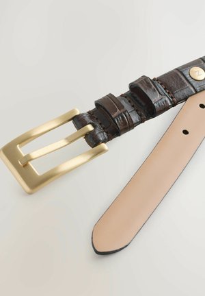 Pruun nahast rihm tekstuuriga osadega, kuldse metallist pandlaga ja sileda beežika aluskihiga, millel on mitu reguleerimisaasa.