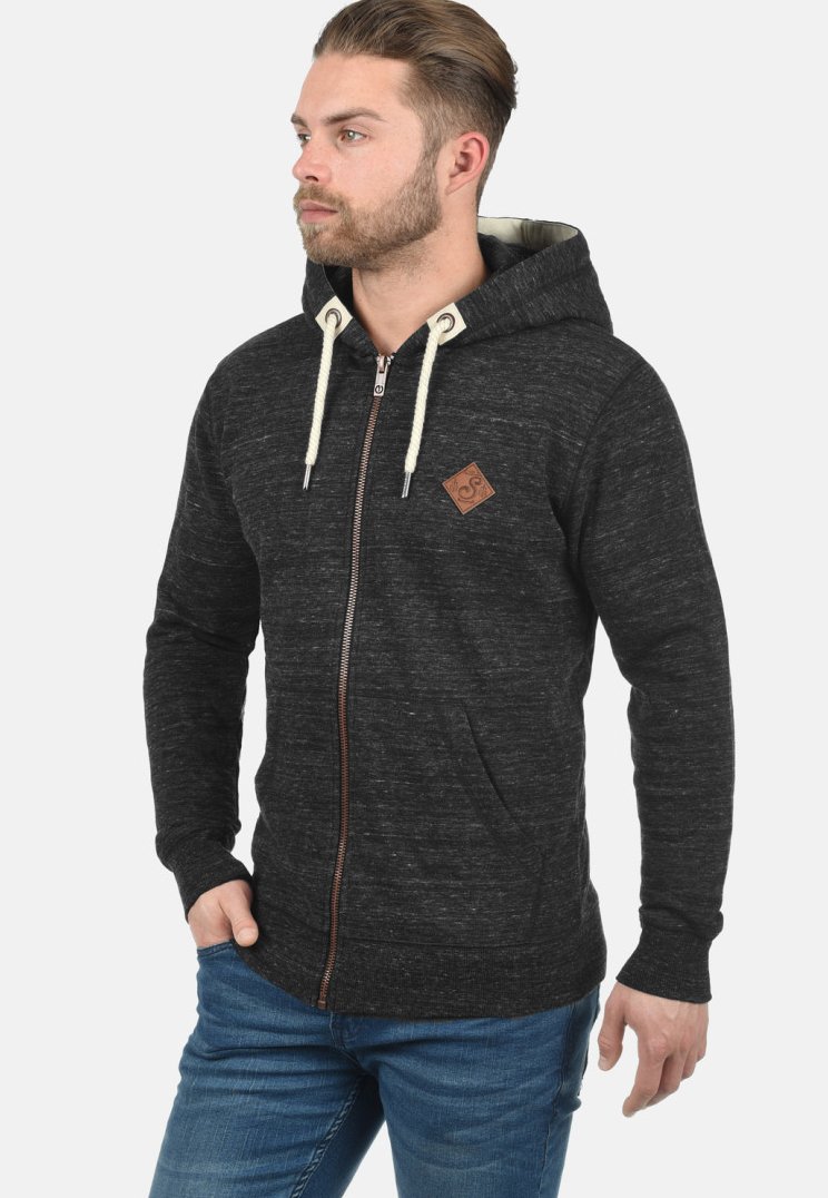 Zippered hoodie made of dark gray knit fabric, featuring a cream-colored drawstring, brown leather logo patch, and front pockets.