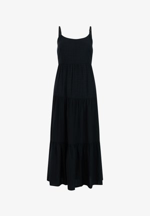 Zwarte mouwloze maxi-jurk met verstelbare dunne bandjes, gelaagde rok en subtiel getextureerd stippenpatroon.