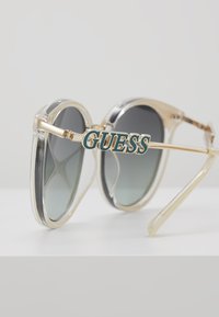 Guess Óculos de sol - beige