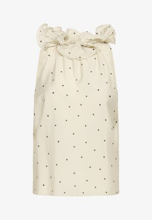 Top sans manches en crème, avec un col à volants, orné de petits pois gris, fabriqué en tissu doux. Coupe standard avec un ourlet droit.