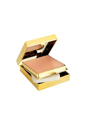 Guldsminkcompact med spegel, med ett rosa puder inuti och en vit applicatorsvamp i ett nedre fack.
