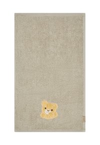 Soft beige towel with a textured terry surface. Features a yellow bear embroidery detail in the bottom corner. Trimmed with a matching border.