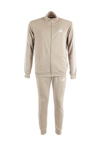 Tuta beige realizzato in materiale liscio, dotato di giacca con zip e colletto alto, con strisce bianche su maniche e pantaloni.