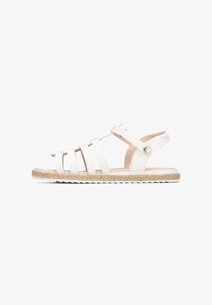 Sandalias blancas de tiras con suela de yute trenzado, que presentan cuatro tiras estrechas y un cierre ajustable en el tobillo, textura suave y diseño minimalista.