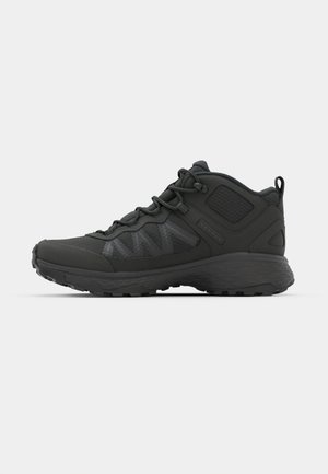Black mid-top hiking shoes featuring a textured upper, reinforced panels, sturdy laces, and a rugged outsole for traction.