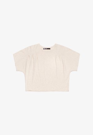 Top court beige clair avec un col rond, des manches courtes et larges, et de subtils détails de plis à l'avant, fabriqué en tissu doux et texturé.