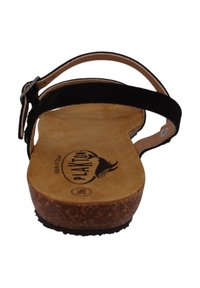 Sandalias de ante negro con suela de corcho, correa ajustable y una plantilla beige con logo. Diseñadas para ofrecer comodidad y estabilidad.