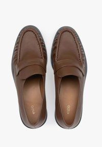 Brown leather loafers with textured, pleated design, round toe, flat rubber sole, and stitched detailing along the upper.
