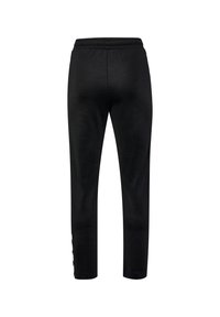 Zwarte joggers met een elastische tailleband en nauwsluitende manchetten, voorzien van witte logodetails aan de zijkant. Zachte stofstructuur.