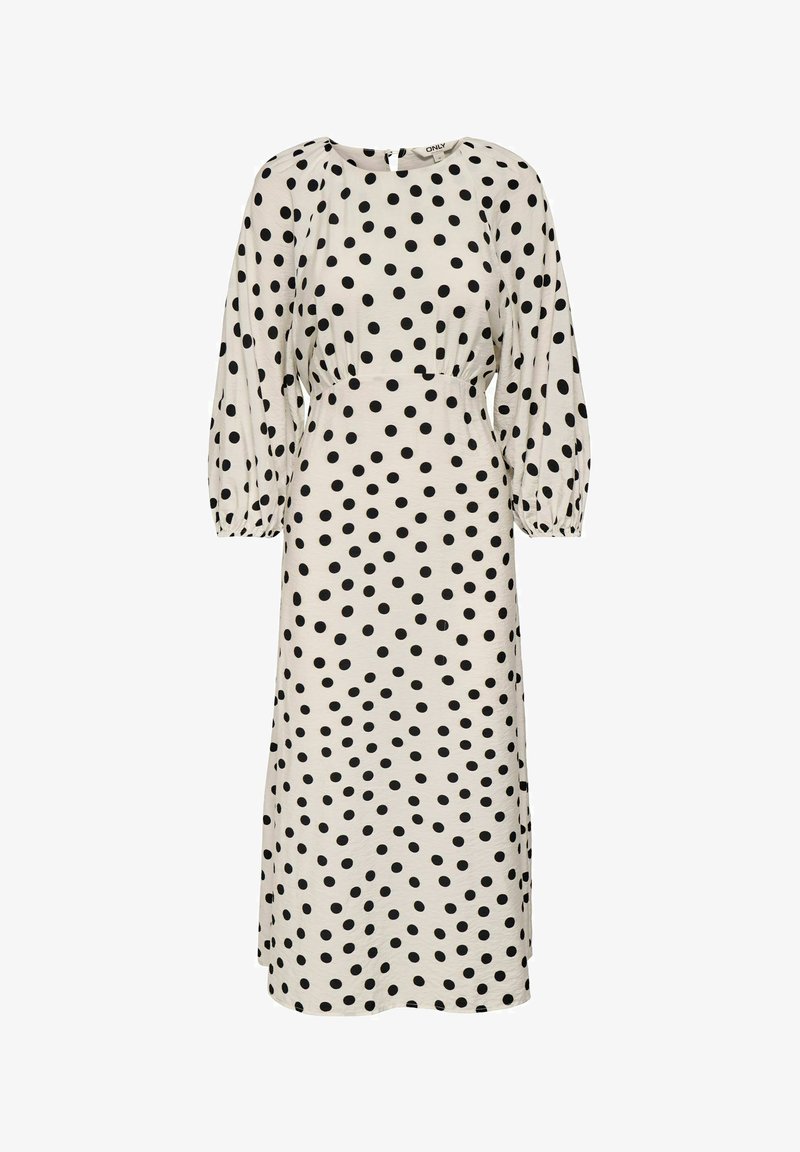 Robe midi blanche à pois noirs, manches longues bouffantes, taille cintrée et encolure ronde.