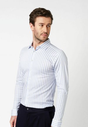 Light blue and white striped button-up shirt with a collar and long sleeves, made of a smooth fabric, featuring front buttons and cuff accents.