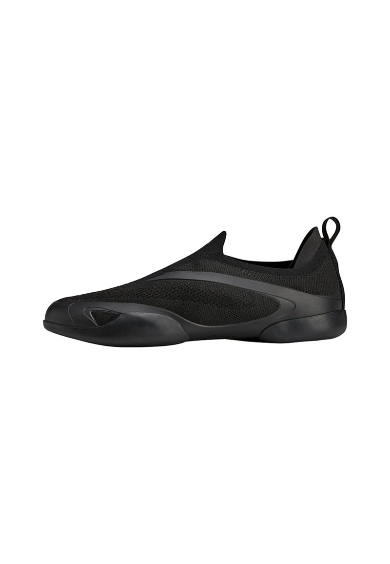 Black slip-on shoes featuring a breathable knit upper, smooth rubber sole, and a streamlined design with a subtle accent line on the side.