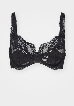 Soutien-gorge en dentelle noire avec des bordures en dentelle festonnée, des bonnets transparents et des bretelles réglables. Le matériau est délicat avec un motif floral.