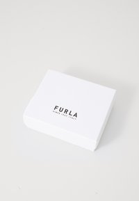 White rectangular box with rounded corners, featuring black "FURLA" logo and text "SINCE 1927 / ITALY" on the lid. Smooth matte finish.