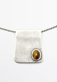 Silver pendant necklace with a smooth rectangular design and a round brown tiger's eye stone set in a silver bezel. Chain features delicate links.