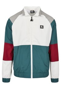 Kolorowa, lekka kurtka przeciwwiatrowa z białymi, turkusowymi, bordowymi i szarymi panelami, zamkiem błyskawicznym i elastycznymi mankietami.