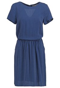 Mörkblå klänning med kort ärm och rund halsringning, elastisk midja och vit prickig mönster överallt. Flödande tyg.