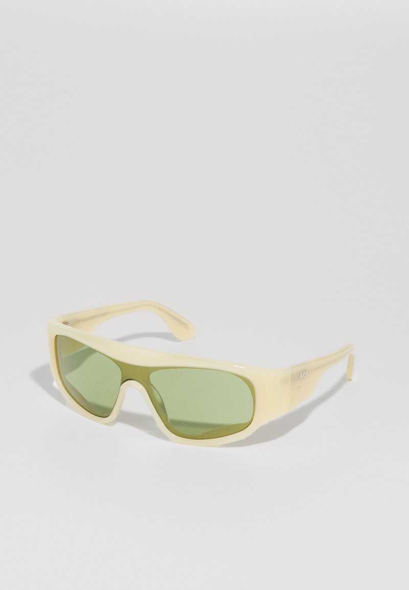 Yellow plastic sunglasses with green tinted lenses. Features a wraparound shape and wide, curved temples for a sporty look. No visible branding.