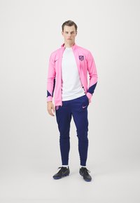 Nike Performance ATLETICO MADRID NIKE DF STRIKE TRACKSUIT THIRD - Equipación de clubes - pink glow/blue void