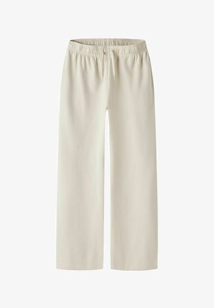 Beige sweatpants met wijde pijpen, een elastische tailleband en een trekkoord. Zacht materiaal met een gladde textuur, zonder zichtbare zakken of patronen.