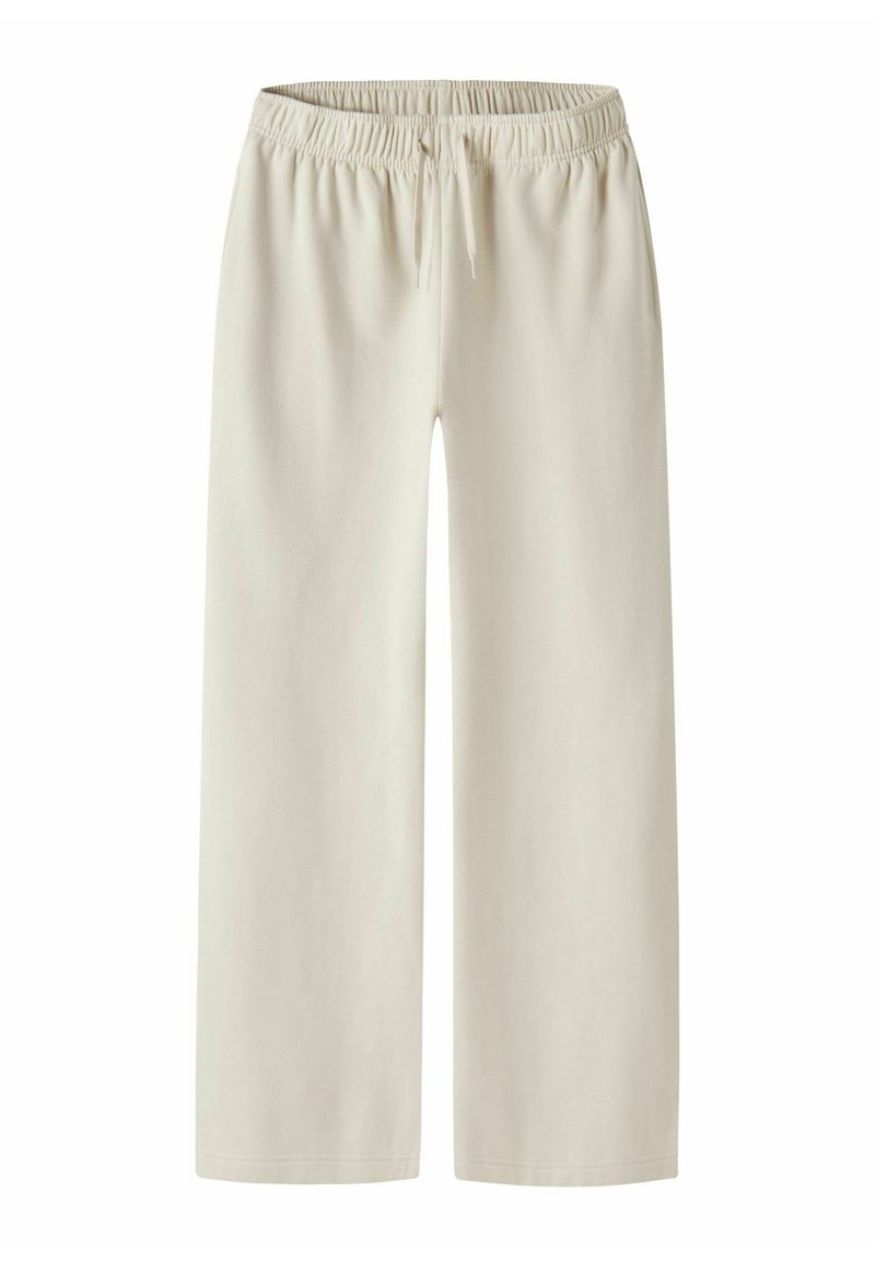 Bež široke športne hlače s širokim pasom iz elastike in vrvico za zavezovanje. Mehka tkanina z gladko teksturo, brez vidnih žepov ali vzorcev.
