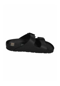 Black slide sandal featuring a smooth synthetic upper, two adjustable straps with buckles, textured sole, and an open-toe design.