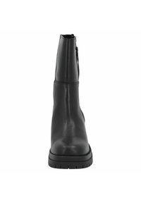 Black leather ankle boot with a smooth texture, rounded toe, and a low, ridged sole. Features a side zipper for easy wear.