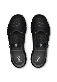 Schwarze Sportschuhe mit einem Obermaterial aus Mesh, strukturierten Akzenten und reflektierenden Details. Verfügt über eine dicke Gummilaufsohle und eine gepolsterte Innensohle.