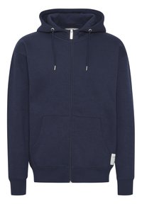 Navy zip-up hoodie made of soft fabric. Features a drawstring hood, front pockets, ribbed cuffs, and a small logo on the sleeve.