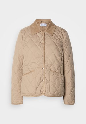 Beige kviltad jacka med knappfront, två fickor med lappar och en kontrasterande kordflodera krage.