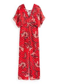 Robe rouge avec un décolleté en V, en tissu transparent, à manches courtes et avec un lien de serrage à l'arrière. Présente des motifs floraux et à pois de couleurs contrastées.