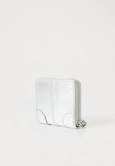 Metallic silver wallet with smooth texture, zip closure, and geometric accents. Compact rectangular shape with visible stitching details.