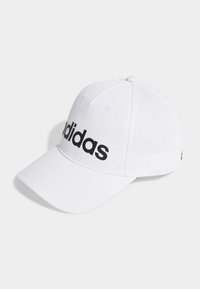 White baseball cap made of fabric featuring a curved brim, six panels, and a black "adidas" logo across the front.